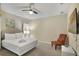 Bedroom with a king-size bed and an accent chair at 8911 Stinger Dr, Champions Gate, FL 33896