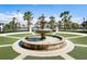 Community fountain with lush landscaping at 8911 Stinger Dr, Champions Gate, FL 33896