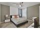 Bedroom with a queen-size bed and modern decor at 8911 Stinger Dr, Champions Gate, FL 33896
