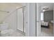 Bathroom with shower stall and toilet, featuring marble-look tile at 8911 Stinger Dr, Champions Gate, FL 33896