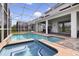 Enjoy this relaxing spa adjacent to the pool at 8911 Stinger Dr, Champions Gate, FL 33896