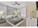 Main bedroom with a king-size bed and neutral decor at 8911 Stinger Dr, Champions Gate, FL 33896