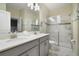 Bathroom boasts double vanity, large shower and tile flooring at 8911 Stinger Dr, Champions Gate, FL 33896