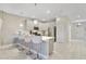 Modern kitchen with stainless steel appliances and an island with seating at 8911 Stinger Dr, Champions Gate, FL 33896