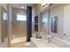 Modern bathroom with white vanity, gray tile, and a shower/tub combo at 1400 Arklow Cir, Ormond Beach, FL 32174