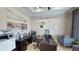 Home office with a desk, seating, and company information at 1400 Arklow Cir, Ormond Beach, FL 32174