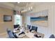 Elegant dining room featuring a chandelier and large artwork at 1400 Arklow Cir, Ormond Beach, FL 32174