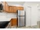 Modern kitchen with stainless steel appliances and quartz countertops at 6119 Metrowest Blvd # 106, Orlando, FL 32835