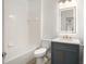 Clean bathroom with a bathtub, toilet and modern vanity at 6119 Metrowest Blvd # 106, Orlando, FL 32835