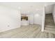Open living room with hardwood floors and modern kitchen view at 6119 Metrowest Blvd # 106, Orlando, FL 32835