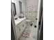 Clean bathroom with a nautical-themed shower curtain and a stylish vanity at 19 Pine Court Loop, Ocala, FL 34472
