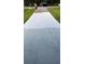 Newly painted driveway with a visible crack running down the center at 19 Pine Court Loop, Ocala, FL 34472