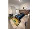 Charming bedroom with a twin-size bed, brick feature wall, and The Mandalorian-themed decor at 19 Pine Court Loop, Ocala, FL 34472