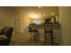 Kitchen with breakfast bar and two barstools at 1080 Condor Dr, Haines City, FL 33844