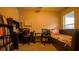 Bedroom with daybed, workspace and built-in shelving at 1080 Condor Dr, Haines City, FL 33844