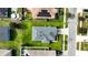 Aerial view of a single-Gathering home with a gray roof and green lawn at 1080 Condor Dr, Haines City, FL 33844