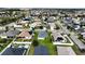 Aerial view of houses in a residential neighborhood with solar panels at 1080 Condor Dr, Haines City, FL 33844