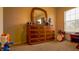 Bedroom with dresser and window at 1080 Condor Dr, Haines City, FL 33844