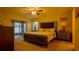 Spacious main bedroom with sliding door access to backyard at 1080 Condor Dr, Haines City, FL 33844