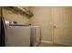 Laundry room with washer, dryer, and shelving for storage at 1080 Condor Dr, Haines City, FL 33844