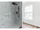 Bathroom with marble shower and large window at 1008 Waterside Dr, Celebration, FL 34747