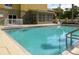 Refreshing hotel pool with easy access and ample seating at 3000 Maingate Ln # 522, Kissimmee, FL 34747