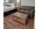 Hotel bedroom featuring a king bed and a small sofa at 3000 Maingate Ln # 522, Kissimmee, FL 34747