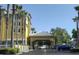 Hotel entrance with covered dropoff and ample parking at 3000 Maingate Ln # 522, Kissimmee, FL 34747