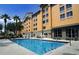 Inviting hotel pool area with plenty of lounge chairs at 3000 Maingate Ln # 522, Kissimmee, FL 34747