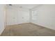 Spacious bedroom with neutral walls, carpet flooring, and ample closet space at 4949 Olivia Ct, St Cloud, FL 34772