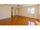 Bright bedroom with wood-look tile floors and ceiling fan at 9076 Sw 95Th Ave # 9076, Ocala, FL 34481