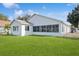Single story home with large sunroom and grassy yard at 9076 Sw 95Th Ave # 9076, Ocala, FL 34481