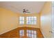 Bright bedroom with tile flooring, ceiling fan and bay window at 9076 Sw 95Th Ave # 9076, Ocala, FL 34481