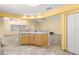 Kitchen with island, tile flooring, and built-in cabinetry at 9076 Sw 95Th Ave # 9076, Ocala, FL 34481