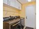 Laundry room with LG washer and dryer and additional shelving at 9076 Sw 95Th Ave # 9076, Ocala, FL 34481