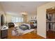 Primary bedroom with a king-size bed, walk-in closet, and wood-look floors at 9076 Sw 95Th Ave # 9076, Ocala, FL 34481