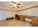 Home office with built-in desk and ample shelving at 9076 Sw 95Th Ave # 9076, Ocala, FL 34481