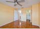 Bright bedroom with tile flooring, ceiling fan, and ample closet space at 9076 Sw 95Th Ave # 9076, Ocala, FL 34481