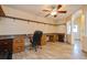 Home office with built-in desk and ample shelving at 9076 Sw 95Th Ave # 9076, Ocala, FL 34481
