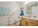 Bathroom with toilet, vanity, and walk-in shower at 9076 Sw 95Th Ave # 9076, Ocala, FL 34481