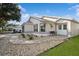 Well-maintained one-story house with a paved walkway and attractive landscaping at 9076 Sw 95Th Ave # 9076, Ocala, FL 34481