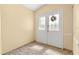 Bright entryway with tile flooring and double doors with stained glass accents at 9076 Sw 95Th Ave # 9076, Ocala, FL 34481