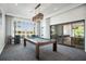 Relax and play in this spacious game room, complete with a pool table at 4162 Grande Brick Loop # 27, Orlando, FL 32837