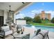 Inviting pool area with outdoor kitchen and seating at 4162 Grande Brick Loop # 27, Orlando, FL 32837