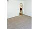 Spacious living room with neutral carpet and arched entryway at 1856 Emily Dr, Winter Haven, FL 33884