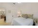 Bright bedroom with a queen bed, adjacent bathroom access at 13524 Turtle Marsh Loop # 638, Orlando, FL 32837