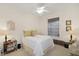 Cozy bedroom with a queen-size bed and ample natural light at 13524 Turtle Marsh Loop # 638, Orlando, FL 32837