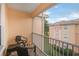 Spacious screened balcony with seating for two at 13524 Turtle Marsh Loop # 638, Orlando, FL 32837