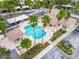 Community pool with surrounding patio and lush landscaping at 13524 Turtle Marsh Loop # 638, Orlando, FL 32837