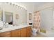 Clean bathroom with a tub shower combo and wood vanity at 13524 Turtle Marsh Loop # 638, Orlando, FL 32837